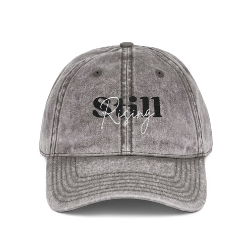 Distressed "Still Rising" Embroidered Baseball Cap — Red, Charcoal or Maroon